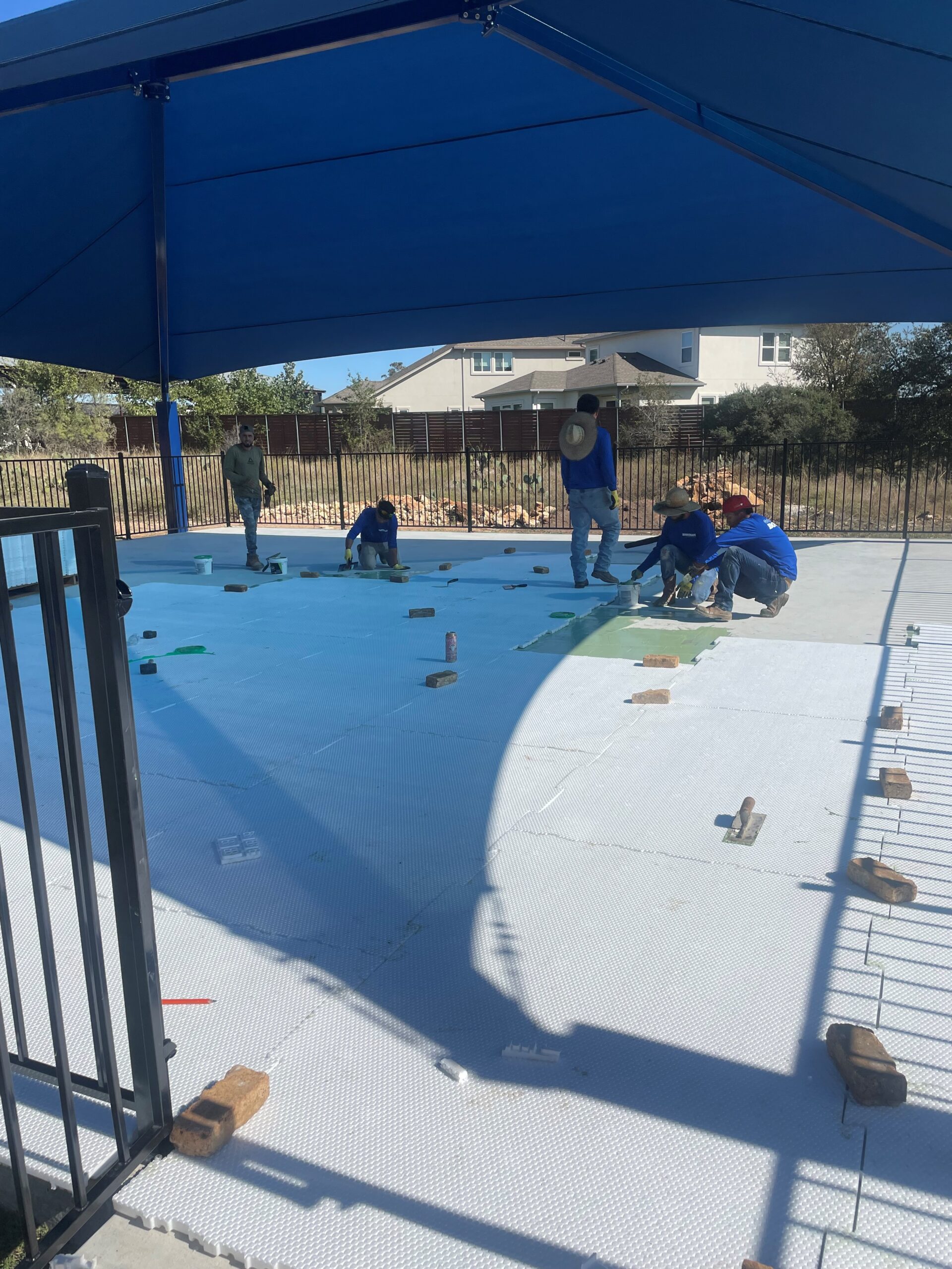 playground progress – installing turf – shout out to Bowman Outdoor Living